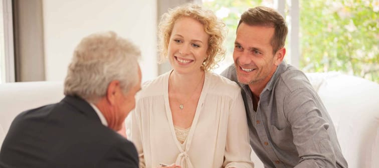 Financial advisor talking with clients